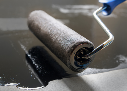 repair using a paint roller and putty on a flat surface
